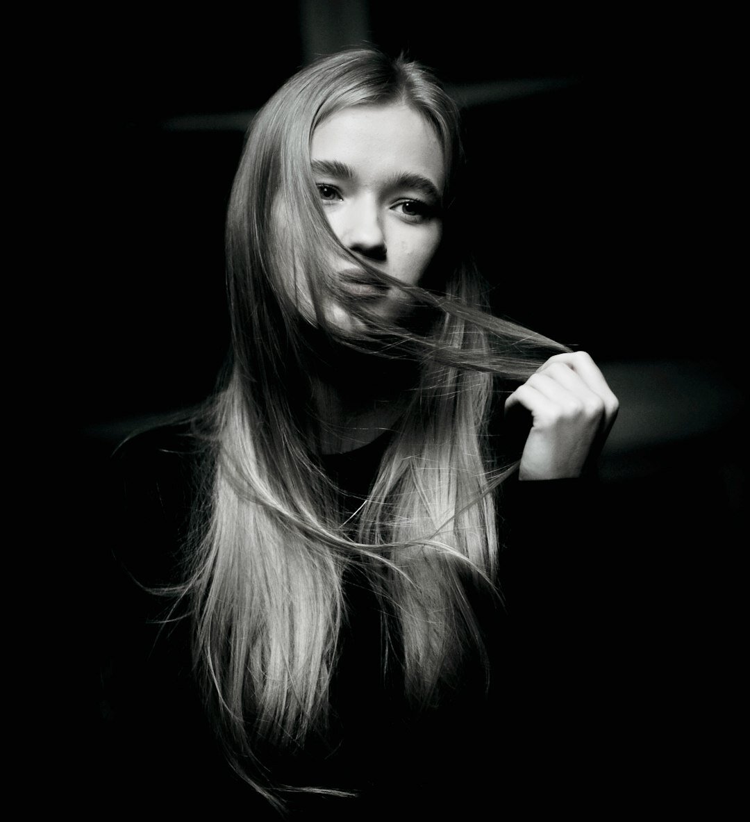 Studio portrait of a woman with long straight hair